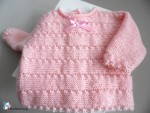 Trousseau bb fille coloris rose en calinou, tricoté main 2